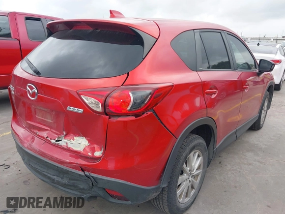 2015 Mazda CX-5 Touring with VIN JM3KE4CYXF0439953, listed as a IAAI auction lot 42124197 with 242,614 mi miles and . Bid and sale history available at DreamBid. Image 4.