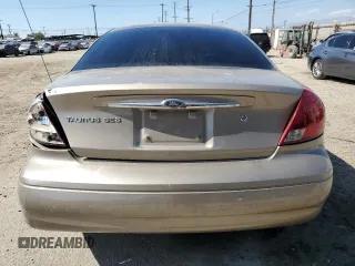 2003 Ford Taurus SES Standard z VIN 1FAFP55253G138373, wystawiony jako Copart lot #57124335 z przebiegiem 89 136 mil mil oraz Szkoda całkowita • Salvage title. Historia ofert i sprzedaży dostępna na DreamBid. Obrazek 6.
