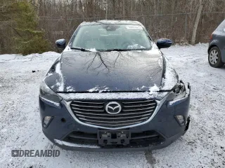 2018 Mazda CX-3 Grand Touring z VIN JM1DKFD73J0309811, wystawiony jako Copart lot #50003315 z przebiegiem 135 365 mil mil oraz Czysty tytuł • Clean title. Historia ofert i sprzedaży dostępna na DreamBid. Obrazek 5.