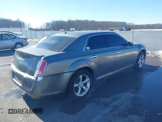 2011 Chrysler 300 with VIN 2C3CA6CTXBH563112, listed as a IAAI auction lot 41374372 with 151,947 mi miles. Bid and sale history available at carsss.com. Image 4.