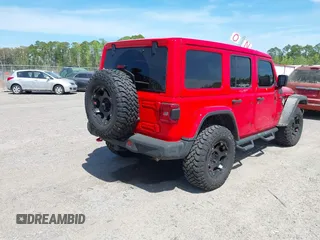 2020 Jeep Wrangler Unlimited Rubicon with VIN 1C4HJXFG9LW106607, listed as a IAAI auction lot 41908295 with 71,083 mi miles and . Bid and sale history available at DreamBid. Image 4.