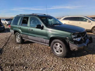 2001 Jeep Grand Cherokee Laredo with VIN 1J4GW48N21C570404, listed as a Copart auction lot 85996954 with 153,838 mi miles and Salvage Title. Bid and sale history available at carsss.com. Image 4.
