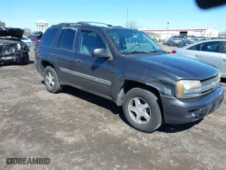 2004 Chevrolet TrailBlazer LS with VIN 1GNDT13S142391821, listed as a IAAI auction lot 41860650 with 184,915 mi miles. Bid and sale history available at carsss.com. Image 1.