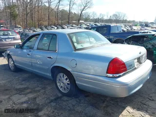 2005 Ford Crown Victoria LX with VIN 2FAFP74W65X135964, listed as a IAAI auction lot 41271175 with 82,494 mi miles. Bid and sale history available at carsss.com. Image 14.