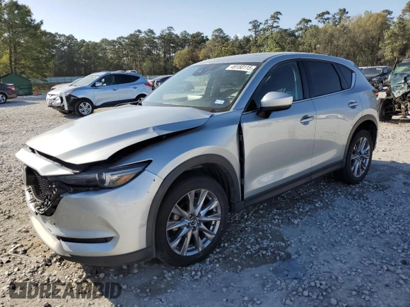 2021 Mazda CX-5 Grand Touring with VIN JM3KFADM8M1339008, listed as a Copart auction lot 49150115 with 144,851 mi miles and Salvage Title. Bid and sale history available at carsss.com. Image 1.