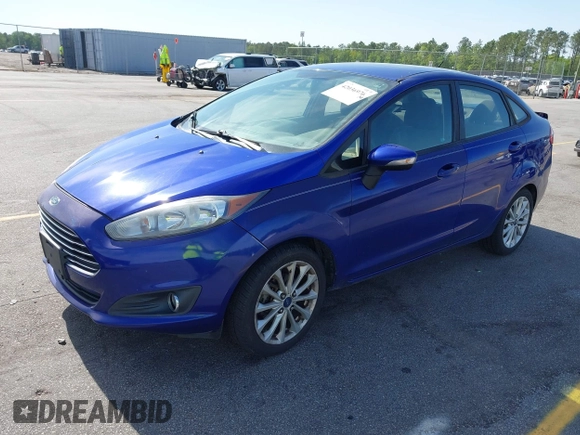 2014 Ford Fiesta SE with VIN 3FADP4BJ5EM190009, listed as a IAAI auction lot 42036976 with 157,575 mi miles. Bid and sale history available at carsss.com. Image 2.