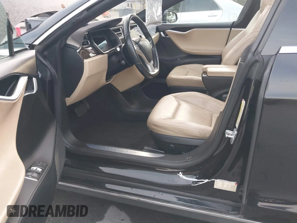 2016 Tesla Model S 70 with VIN 5YJSA1E11GF132015, listed as a IAAI auction lot 41408676 with 137,271 mi miles and . Bid and sale history available at DreamBid. Image 6.
