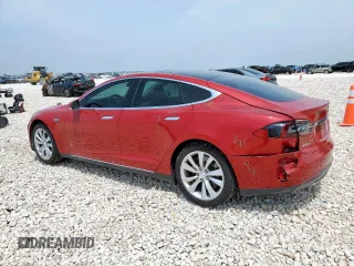 2014 Tesla Model S 60 with VIN 5YJSA1H18EFP38582, listed as a Copart auction lot 56581735 with 69,106 mi miles and Salvage title. Bid and sale history available at DreamBid. Image 2.