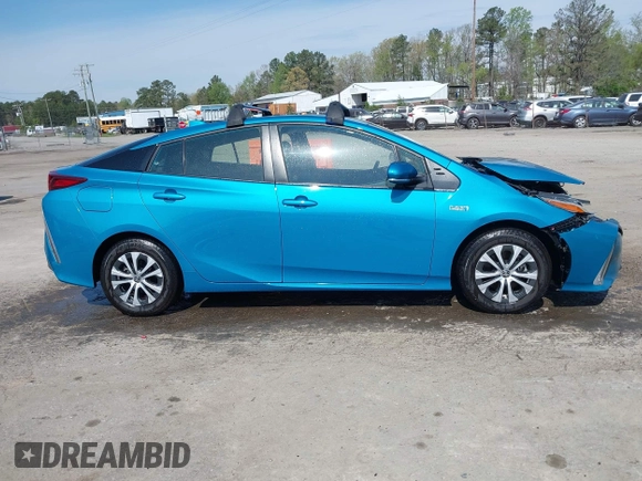 2021 Toyota Prius LE with VIN JTDKAMFP7M3180504, listed as a IAAI auction lot 41985409 with 56,617 mi miles and . Bid and sale history available at DreamBid. Image 13.