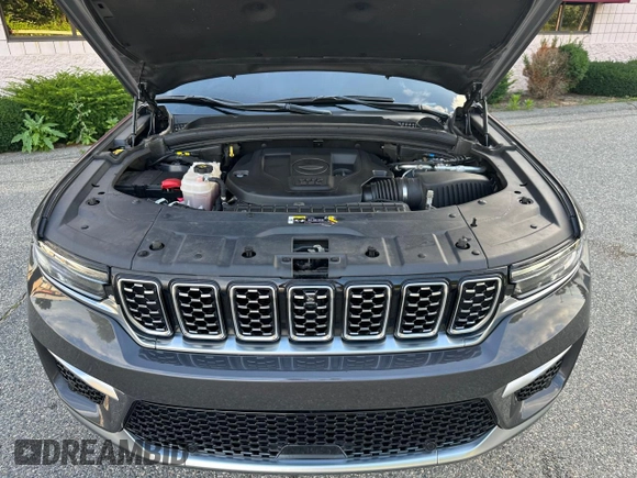 2023 Jeep Grand Cherokee Summit with VIN 1C4RJHEG2P8882566, listed as a Copart auction lot 65095905 with 59,970 mi miles and Salvage title. Bid and sale history available at DreamBid. Image 7.