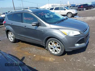2014 Ford Escape Titanium with VIN 1FMCU9J99EUA75276, listed as a IAAI auction lot 42148537 with 163,330 mi miles and . Bid and sale history available at DreamBid. Image 1.