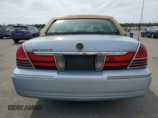 2005 Mercury Grand Marquis GS z VIN 2MEFM74W75X603444, wystawiony jako Copart lot #54395945 z przebiegiem 110 933 mil mil oraz Czysty tytuł • Clean title. Historia ofert i sprzedaży dostępna na DreamBid. Obrazek 6.