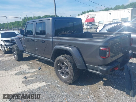 2021 Jeep Gladiator Rubicon z VIN 1C6JJTBG9ML592538, wystawiony jako IAAI lot #42206035 z przebiegiem 37 945 mil mil oraz . Historia ofert i sprzedaży dostępna na DreamBid. Obrazek 3.