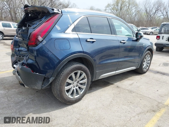 2021 Cadillac XT4 AWD Premium Luxury z VIN 1GYFZDR45MF048569, wystawiony jako IAAI lot #41902941 z przebiegiem 53 891 mil mil oraz . Historia ofert i sprzedaży dostępna na DreamBid. Obrazek 4.