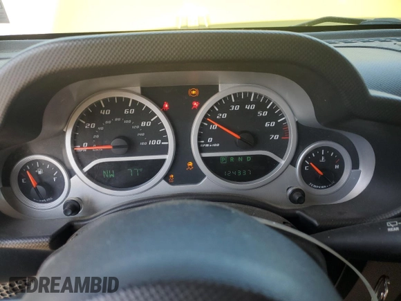 2010 Jeep Wrangler Sahara with VIN 1J4AA5D16AL203910, listed as a Copart auction lot 62891315 with 124,337 mi miles and Salvage title. Bid and sale history available at DreamBid. Image 9.