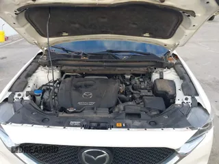 2019 Mazda CX-5 Sport with VIN JM3KFABMXK1655302, listed as a IAAI auction lot 41901293 with 140,369 mi miles and . Bid and sale history available at DreamBid. Image 10.