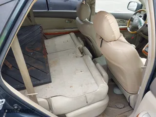 2005 Lexus RX 330 with VIN JTJGA31U050056409, listed as a IAAI auction lot 41828865 with 216,093 mi miles. Bid and sale history available at carsss.com. Image 8.