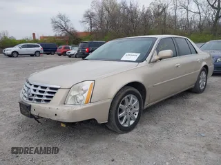 2009 Cadillac DTS w/1SA with VIN 1G6KD57Y29U137410, listed as a IAAI auction lot 42026044 with 112,916 mi miles. Bid and sale history available at carsss.com. Image 2.