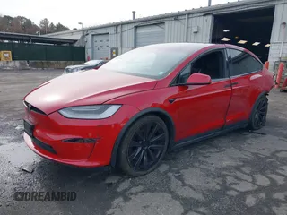 2022 Tesla Model X Plaid with VIN 7SAXCBE60NF330246, listed as a IAAI auction lot 41477394 with 51,612 mi miles and . Bid and sale history available at DreamBid. Image 21.