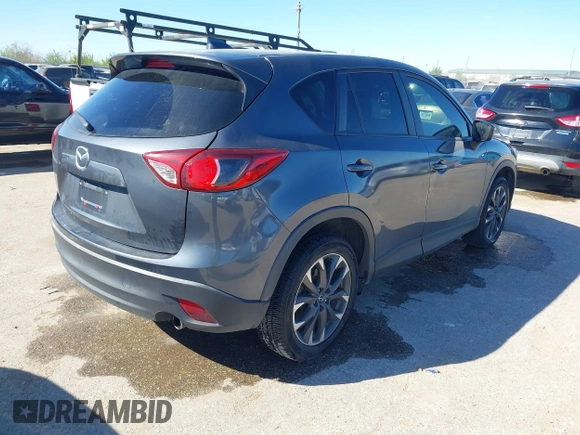 2016 Mazda CX-5 Grand Touring with VIN JM3KE2DYXG0784615, listed as a IAAI auction lot 41846853 with 72,185 mi miles. Bid and sale history available at carsss.com. Image 4.