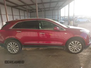 2019 Cadillac XT5 Premium Luxury FWD z VIN 1GYKNERS0KZ157287, wystawiony jako IAAI lot #41106524 z przebiegiem 131 464 mil mil oraz . Historia ofert i sprzedaży dostępna na DreamBid. Obrazek 13.