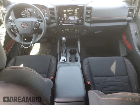 2023 Nissan Frontier Pro-4X with VIN 1N6ED1EK0PN668109, listed as a Copart auction lot 57064975 with 6,406 mi miles and Salvage title. Bid and sale history available at DreamBid. Image 8.