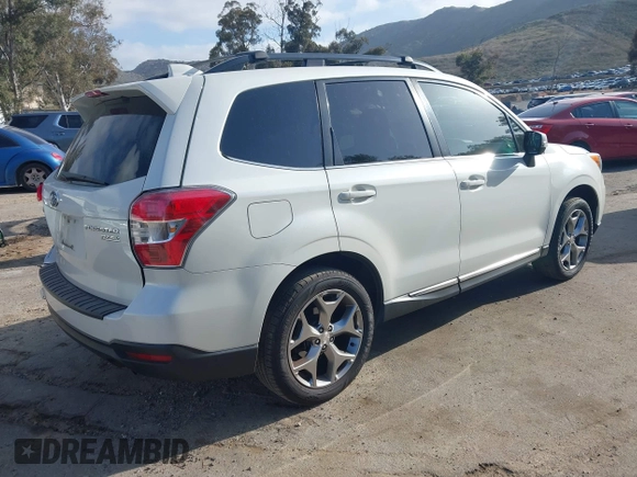 2016 Subaru Forester Touring with VIN JF2SJAXC7GH565287, listed as a IAAI auction lot 41947083 with 126,563 mi miles and . Bid and sale history available at DreamBid. Image 4.