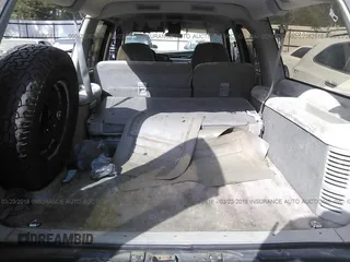 1993 GMC Suburban with VIN 1GKEC16K9PJ754213, listed as a IAAI auction lot 22062516 with 212,780 mi miles. Bid and sale history available at carsss.com. Image 8.