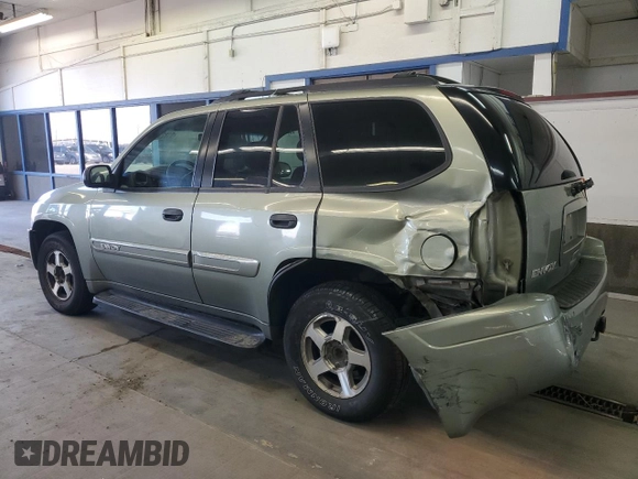 2004 GMC Envoy SLE with VIN 1GKDS13S442417232, listed as a Copart auction lot 51821225 with 242,945 mi miles and Salvage Title. Bid and sale history available at carsss.com. Image 2.