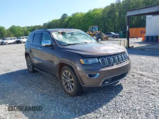 2017 Jeep Grand Cherokee Overland z VIN 1C4RJECG7HC869005, wystawiony jako IAAI lot #42020808 z przebiegiem 148 314 mil mil oraz . Historia ofert i sprzedaży dostępna na DreamBid. Obrazek 1.