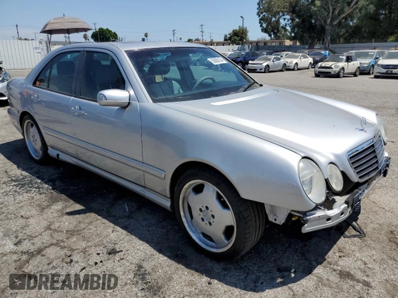 2000 Mercedes-Benz E with VIN WDBJF74J7YB055624, listed as a Copart auction lot 63880184 with 71,355 mi miles and Salvage Title. Bid and sale history available at DreamBid. Image 4.