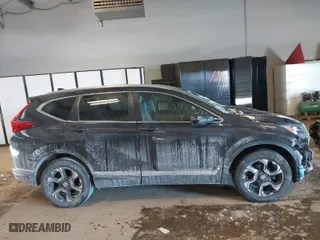 2018 Honda CR-V Touring with VIN 2HKRW2H94JH635053, listed as a IAAI auction lot 41611501 with 76,883 mi miles. Bid and sale history available at carsss.com. Image 13.