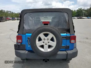 2015 Jeep Wrangler Unlimited Willys Wheeler with VIN 1C4BJWDG4FL611656, listed as a Copart auction lot 54010395 with 129,797 mi miles and Salvage Title. Bid and sale history available at DreamBid. Image 6.