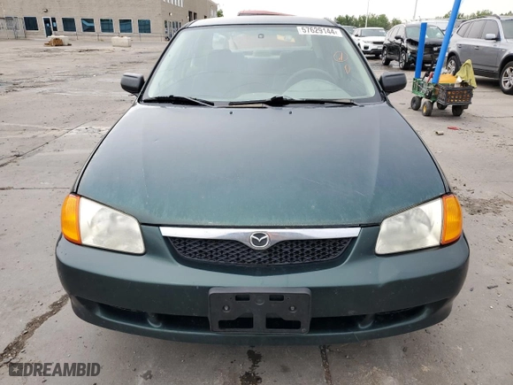1999 Mazda Protege ES with VIN JM1BJ2210X0150711, listed as a Copart auction lot 57629144 with 175,754 mi miles and Salvage Title. Bid and sale history available at carsss.com. Image 5.