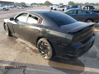 2013 Dodge Charger SE with VIN 2C3CDXBG5DH535058, listed as a IAAI auction lot 42101566 with 205,790 mi miles and . Bid and sale history available at DreamBid. Image 3.