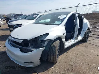2022 Tesla Model Y Long Range with VIN 7SAYGDEE4NF428434, listed as a IAAI auction lot 41578503 with 35,460 mi miles and . Bid and sale history available at DreamBid. Image 6.