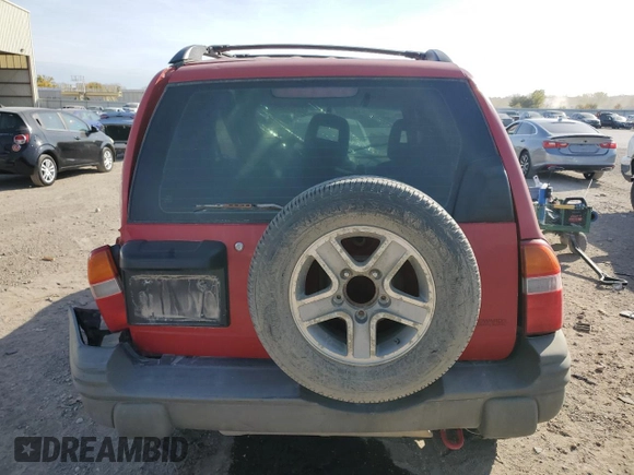 2004 Chevrolet Tracker with VIN 2CNBJ134846911647, listed as a Copart auction lot 77128924 with Not provided miles and Salvage title. Bid and sale history available at DreamBid. Image 6.
