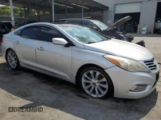 2013 Hyundai Azera z VIN KMHFH4JG8DA213103, wystawiony jako Copart lot #57781955 z przebiegiem 173 515 mil mil oraz Czysty tytuł • Clean title. Historia ofert i sprzedaży dostępna na DreamBid. Obrazek 4.