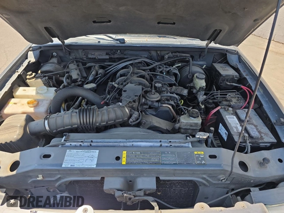 2005 Ford Ranger XLT z VIN 1FTZR45E05PA33894, wystawiony jako Copart lot #60548815 z przebiegiem 154 796 mil mil oraz Czysty tytuł • Clean title. Historia ofert i sprzedaży dostępna na DreamBid. Obrazek 7.