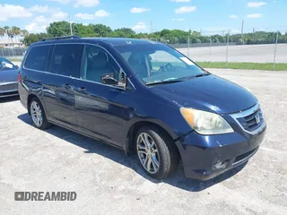 2008 Honda Odyssey Touring with VIN 5FNRL38828B045724, listed as a IAAI auction lot 39567436 with 157,403 mi miles and . Bid and sale history available at DreamBid. Image 1.