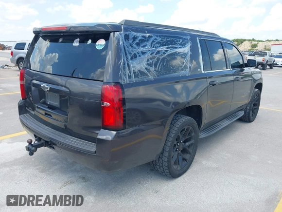 2015 Chevrolet Suburban LT z VIN 1GNSKJKC9FR245097, wystawiony jako IAAI lot #42468168 z przebiegiem 198 454 mil mil oraz . Historia ofert i sprzedaży dostępna na DreamBid. Obrazek 4.