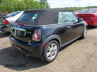 2011 MINI Convertible with VIN WMWZN3C56BT132924, listed as a IAAI auction lot 42161363 with 133,444 mi miles and . Bid and sale history available at DreamBid. Image 4.