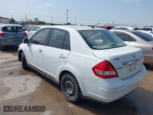 2008 Nissan Versa 1.8 S with VIN 3N1BC11E38L392277, listed as a IAAI auction lot 41927976 with 135,795 mi miles. Bid and sale history available at carsss.com. Image 3.