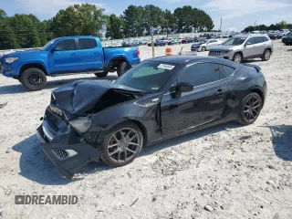 2014 Scion FR-S z VIN JF1ZNAA1XE8707871, wystawiony jako Copart lot #57945695 z przebiegiem 140 517 mil mil oraz Czysty tytuł • Clean title. Historia ofert i sprzedaży dostępna na DreamBid. Obrazek 1.