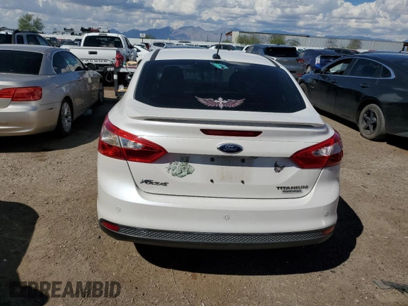 2014 Ford Focus Titanium with VIN 1FADP3J26EL132223, listed as a Copart auction lot 71490004 with 131,233 mi miles and Salvage Title. Bid and sale history available at DreamBid. Image 6.