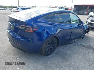 2025 Tesla Model Y Long Range z VIN 7SAYGDED0SF256650, wystawiony jako IAAI lot #41993206 z przebiegiem Nie podano mil oraz . Historia ofert i sprzedaży dostępna na DreamBid. Obrazek 4.