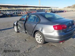 2012 Volkswagen Jetta Sedan SE w/Convenience with VIN 3VWDX7AJ7CM412976, listed as a IAAI auction lot 41823799 with 210,248 mi miles. Bid and sale history available at carsss.com. Image 3.