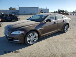 2014 Jaguar XJ with VIN SAJWA1CZ3E8V69877, listed as a Copart auction lot 48159005 with 57,567 mi miles and Clean Title. Bid and sale history available at DreamBid. Image 1.