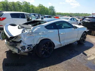 2021 Ford Mustang EcoBoost with VIN 1FA6P8TH6M5148562, listed as a IAAI auction lot 42147236 with 57,050 mi miles and . Bid and sale history available at DreamBid. Image 4.
