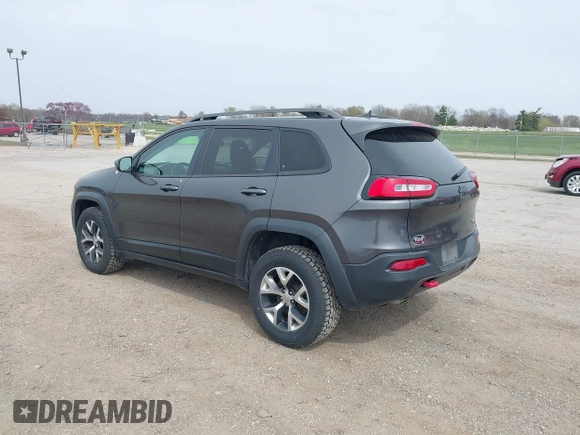2016 Jeep Cherokee Trailhawk z VIN 1C4PJMBS4GW167650, wystawiony jako IAAI lot #41936549 z przebiegiem 218 000 mil mil oraz . Historia ofert i sprzedaży dostępna na DreamBid. Obrazek 3.